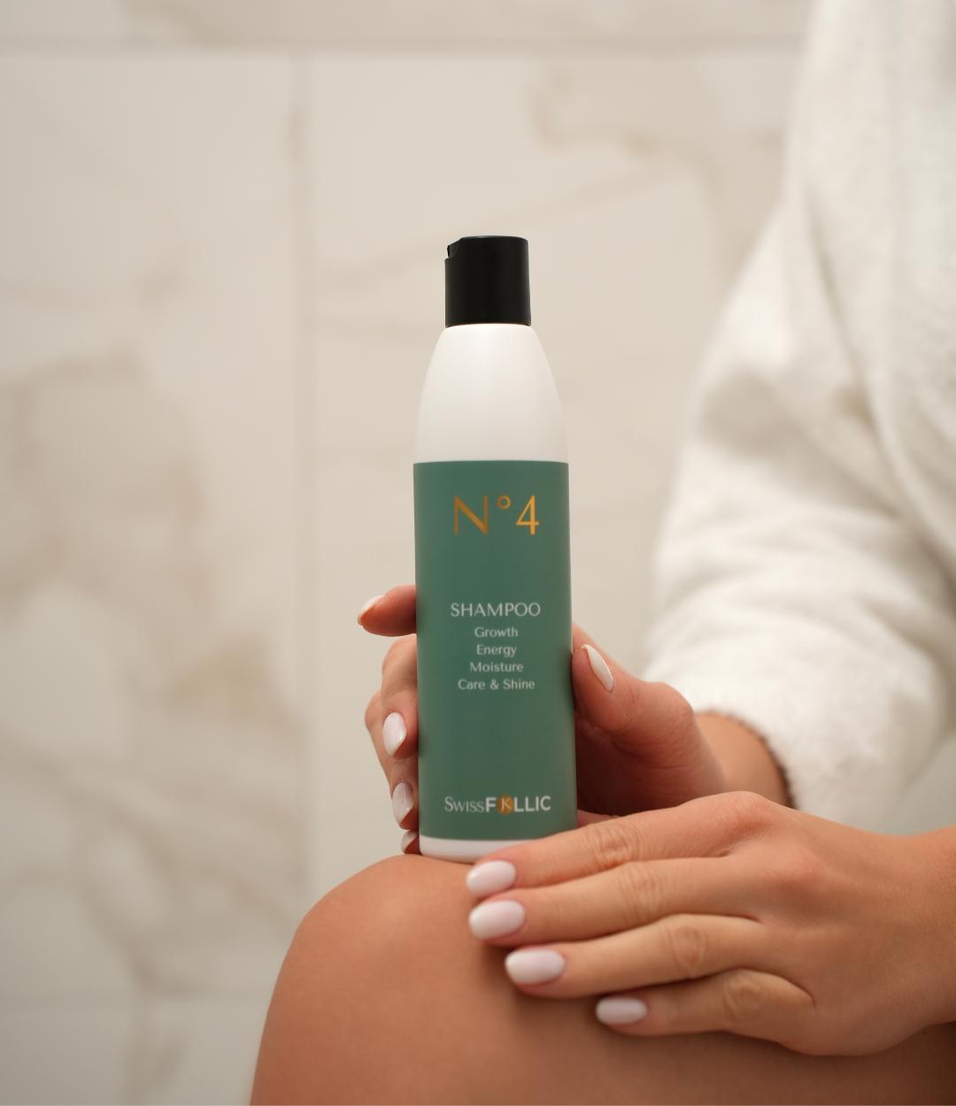 Woman holding Shampoo bottle